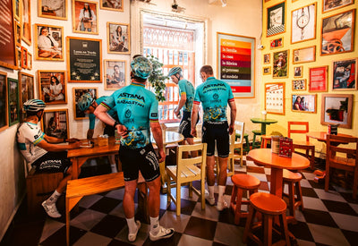 Team Astana riders in cafe wearing Limar cycling helmets