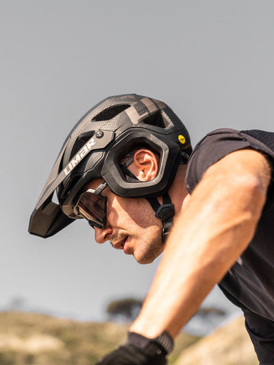 Mountain biker wearing Limar Etna MTB helmet with added ear and temporal protection