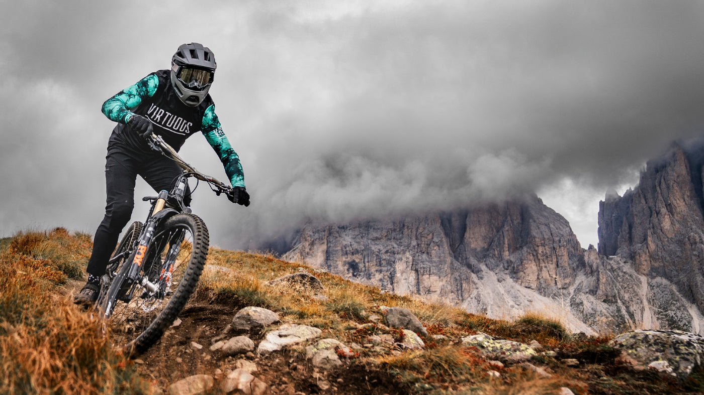 Mountain biker wearing Limar black full face Livigno bike helmet